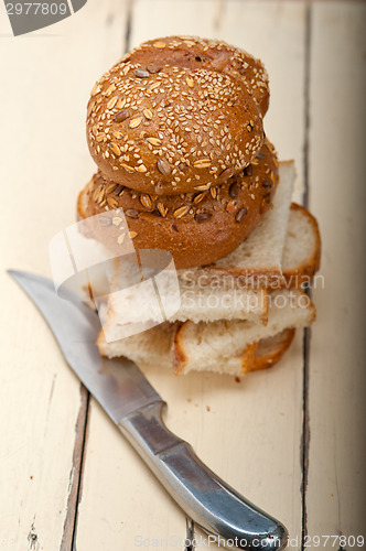 Image of organic bread over rustic table