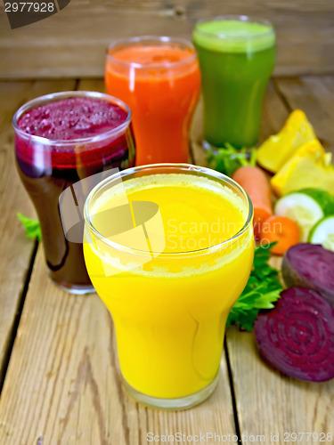 Image of Juice vegetable in four glasses on board