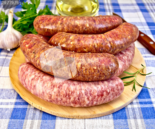 Image of Sausages pork and beef on blue cloth