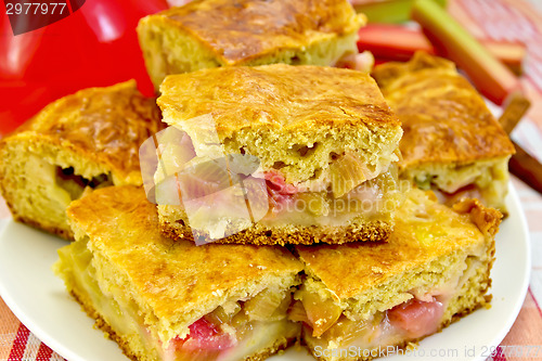 Image of Pie rhubarb and drink on linen tablecloth