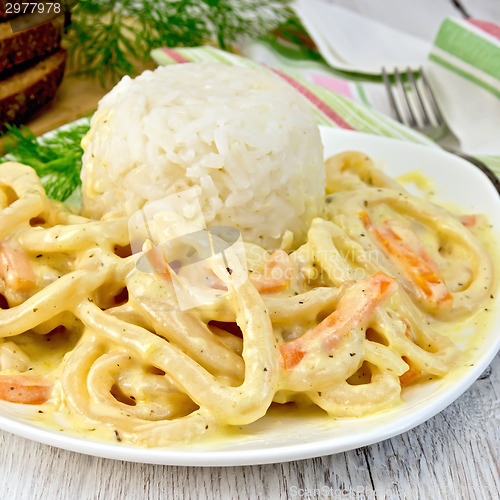 Image of Calamari in cream sauce with rice on board