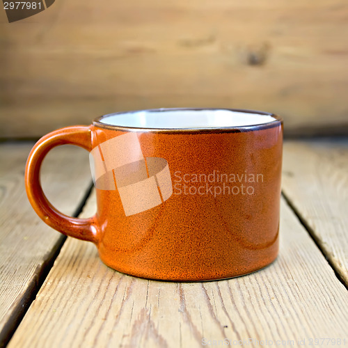Image of Mug brown on wooden board