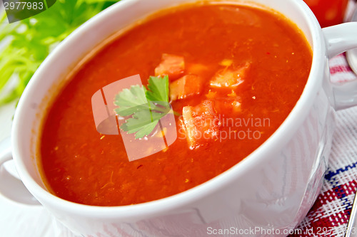 Image of Soup tomato on napkin with parsley