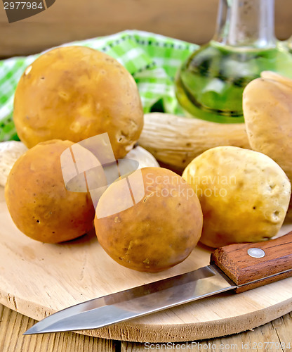 Image of Ceps with knife on the board