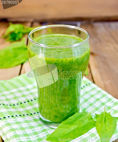 Image of Cocktail with spinach on napkin and board