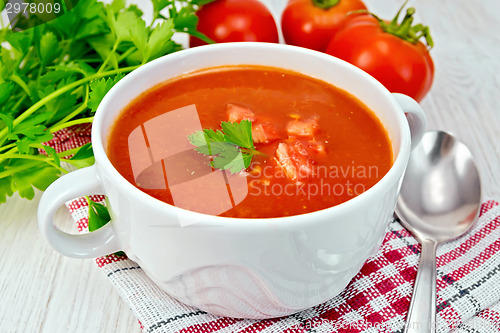 Image of Soup tomato on napkin with pieces on board