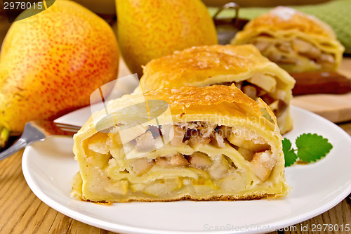 Image of Strudel with pears and mint in bowl on board