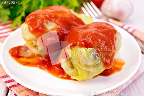 Image of Cabbage stuffed with tomato sauce on plate