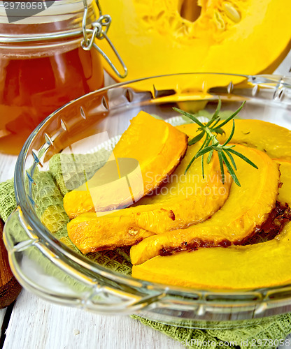 Image of Pumpkin baked in glass pan with honey on board
