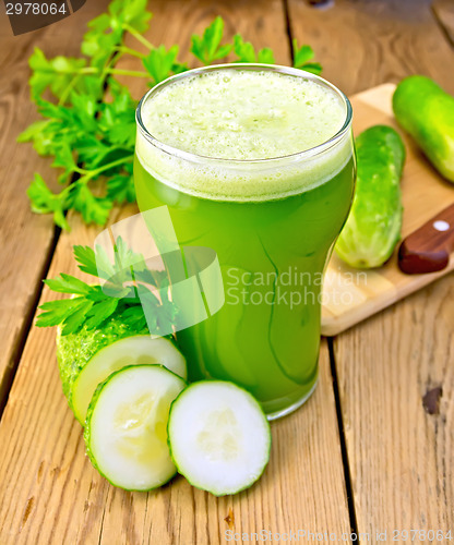 Image of Juice cucumber with knife on board