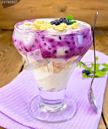 Image of Dessert milk with blueberries on napkin