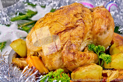 Image of Chicken Christmas with vegetables and silver toys