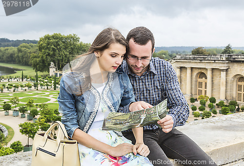 Image of Young Couple Looking in a Map