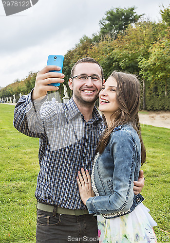 Image of Happy Couple taking a selfie in a French Garden