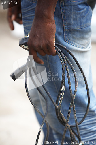 Image of African man with defective computer cables