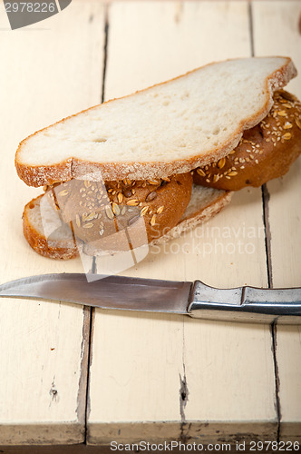 Image of organic bread over rustic table