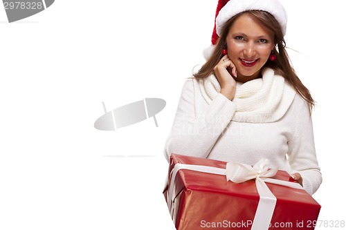 Image of Pretty woman in a Santa hat with a large gift