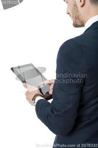 Image of Businessman using a tablet computer