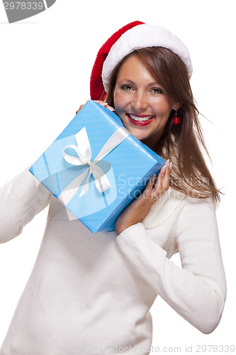 Image of Beautiful vivacious woman with a Christmas gift