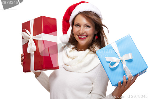 Image of Vivacious woman in a Santa hat celebrating Xmas