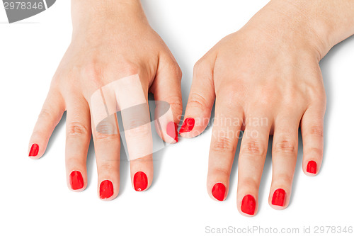 Image of Woman with beautiful manicured red fingernails