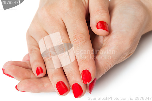 Image of Woman with beautiful manicured red fingernails