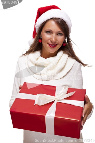 Image of Pretty woman in a Santa hat with a large gift