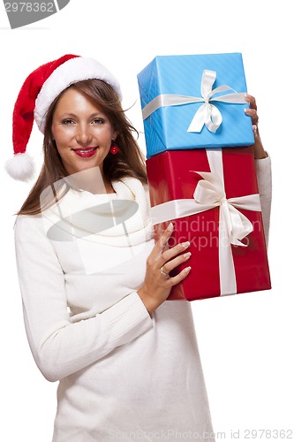 Image of Vivacious woman in a Santa hat celebrating Xmas