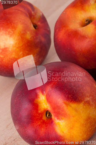 Image of Three tasty fresh ripe juicy nectarines