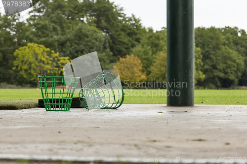 Image of Empty Golf Ball Baskets at Driving Range