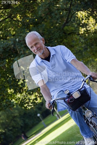 Image of Senior Man Riding Bicycle