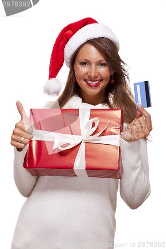 Image of Smiling woman purchasing Christmas gifts