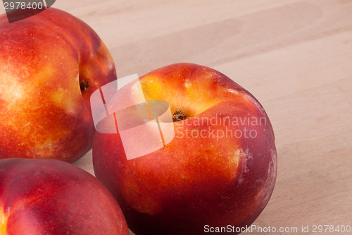 Image of Three tasty fresh ripe juicy nectarines