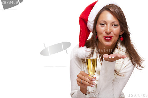 Image of Playful woman celebrating Xmas blowing a kiss