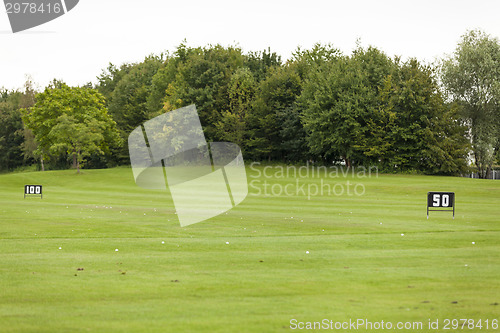 Image of Empty Golf Ball Baskets at Driving Range