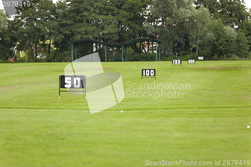 Image of Empty Golf Ball Baskets at Driving Range