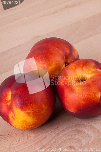 Image of Three tasty fresh ripe juicy nectarines