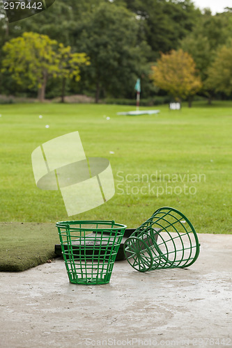 Image of Empty Golf Ball Baskets at Driving Range