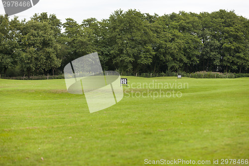 Image of Empty Golf Ball Baskets at Driving Range