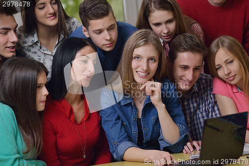 Image of happy teens group in school