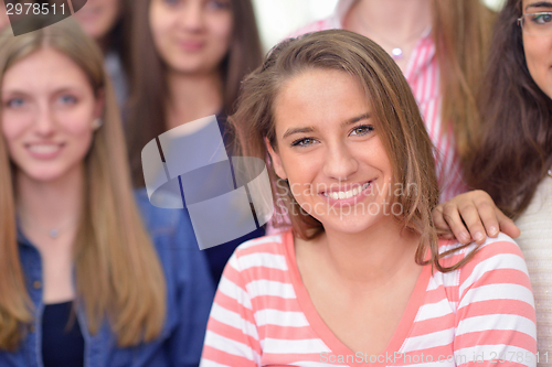 Image of happy teens group in school