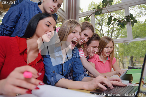 Image of happy teens group in school