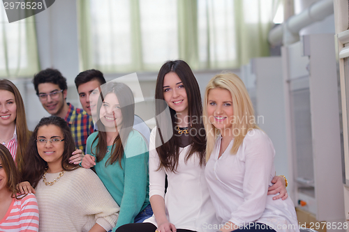 Image of happy teens group in school