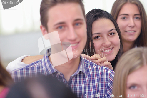 Image of happy teens group in school