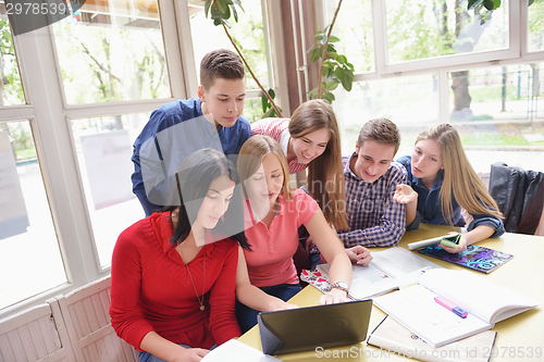 Image of happy teens group in school