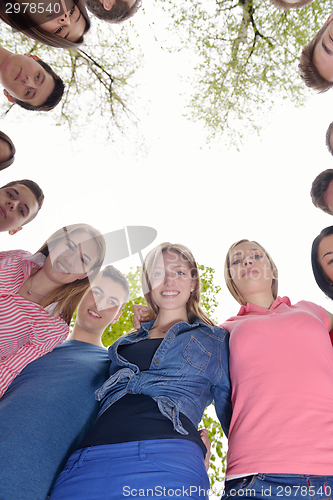 Image of young friends staying together outdoor in the park