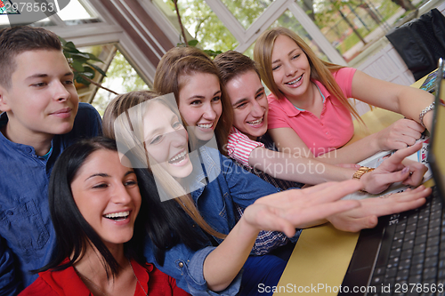 Image of happy teens group in school