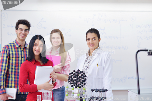 Image of happy teens group in school