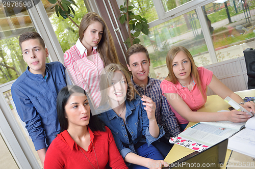 Image of happy teens group in school