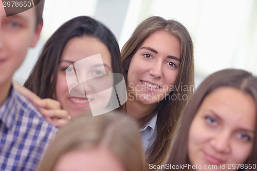 Image of happy teens group in school